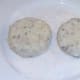 Formed fishcakes on flour