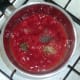 Tomatoes are seasoned in saucepan