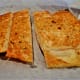 Garlic bread accompanies meals at Clementines