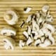 Halve the mushrooms and then slice them up. It's not important to be precise but keep them as even as possible.