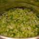 Cook diced vegetables in butter in a large pot. This photo shows the veggies during the cooking process -- but they're not ready yet.