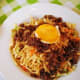 Pancit batil patong: Miki noodles, carabeef meat, and bean sprouts, topped with fried egg and often served with a small bowl of egg-drop soup (hence the names "batil" and "patong"). Comes from Tuguegarao, Philippines.