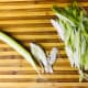 Thinly slice the scallions on the bias. To do this, slice at about a 45 degree angle. For this recipe you will use the entire scallion, both green and white.