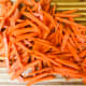 Either use your fine knife skills to thinly julienne your carrots, or simply use a mandolin to shred them. Of course, you can also buy pre-shredded carrots to save some time.
