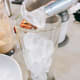 Assemble the coffee: In a tall glass, add the ice cubes.