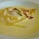 Housemade goat cheese beet raviolo with truffle cream and toasted almonds