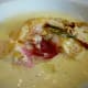 Cutting into the housemade raviolo (singular of ravioli)