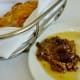 Bread, butter, and olive tapenade is brought to each table.