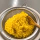 The next day, transfer the rice to a strainer to drain the water out.