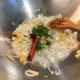Saute the shallots, ginger, garlic, cloves, cinnamon stick, cardamom, star anise, and the curry powder.