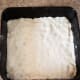 Spread dough into a greased 9x9 baking pan.