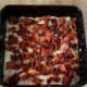 Break pieces of fried bacon into the pan.