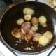 Frying potatoes, onion and garlic with spices