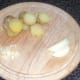 Sliced boiled potatoes, onion and garlic