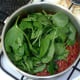 Spinach is added to simmering curry