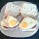 Spiced and sunny side up bread rolls are laid on top of corned beef