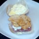 Steak crisps are laid on top of the coleslaw