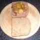 Fried potatoes and onions are arranged on top of corned beef