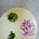 Chopped onions, chopped green chillies and curry leaves