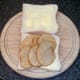 Potato slices are laid on slice of bread