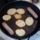 Potatoes are fried with sausages