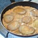 Egg is set around fried potatoes