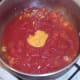 Mustard is added to spicy tomato sauce