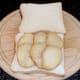 Slices of potato are arranged on one of the slices of bread