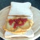 Optional tomato ketchup is added to fried potato omelette