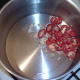 Garlic and red chilli is briefly sauteed