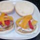 Bell pepper slices are laid on top of chicken meat