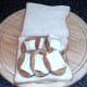 Fried potatoes and goats cheese discs are laid on one slice of bread