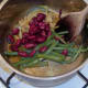 beans are added to hot spice mix