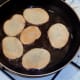 Potatoes are turned to fry on second sides