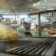 Pita bread coming down the conveyor belt