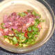 Chopped bacon is added to salad