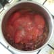 Tomatoes and seasonings are added to curried onions