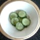 Pickling cucumber slices with white wine vinegar and dill