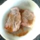 Spiced and seasoned chicken thighs are ready for the oven