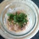 Coriander/cilantro is stirred through chilli sauce