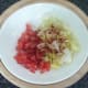Diced tomato and shredded lettuce are seasoned and spiced
