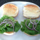 Lettuce and onion on toasted rolls