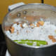 Step two: Add the yam pieces into a mixer jar. Add green chilies, soaked tamarind, grated coconut, and salt.