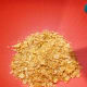 In a medium bowl, add the crushed cornflakes.