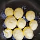 Place the milk solids in a heavy-bottomed pan.