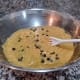 Last but not least, fold in the chocolate chips with a mixing spoon.