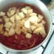 Chopped potatoes are added to surry sauce
