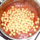 Chickpeas are added to curry sauce