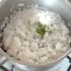 Chopped mint is added to drained rice