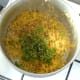 Coriander (cilantro) and black pepper are added to turmeric brown rice